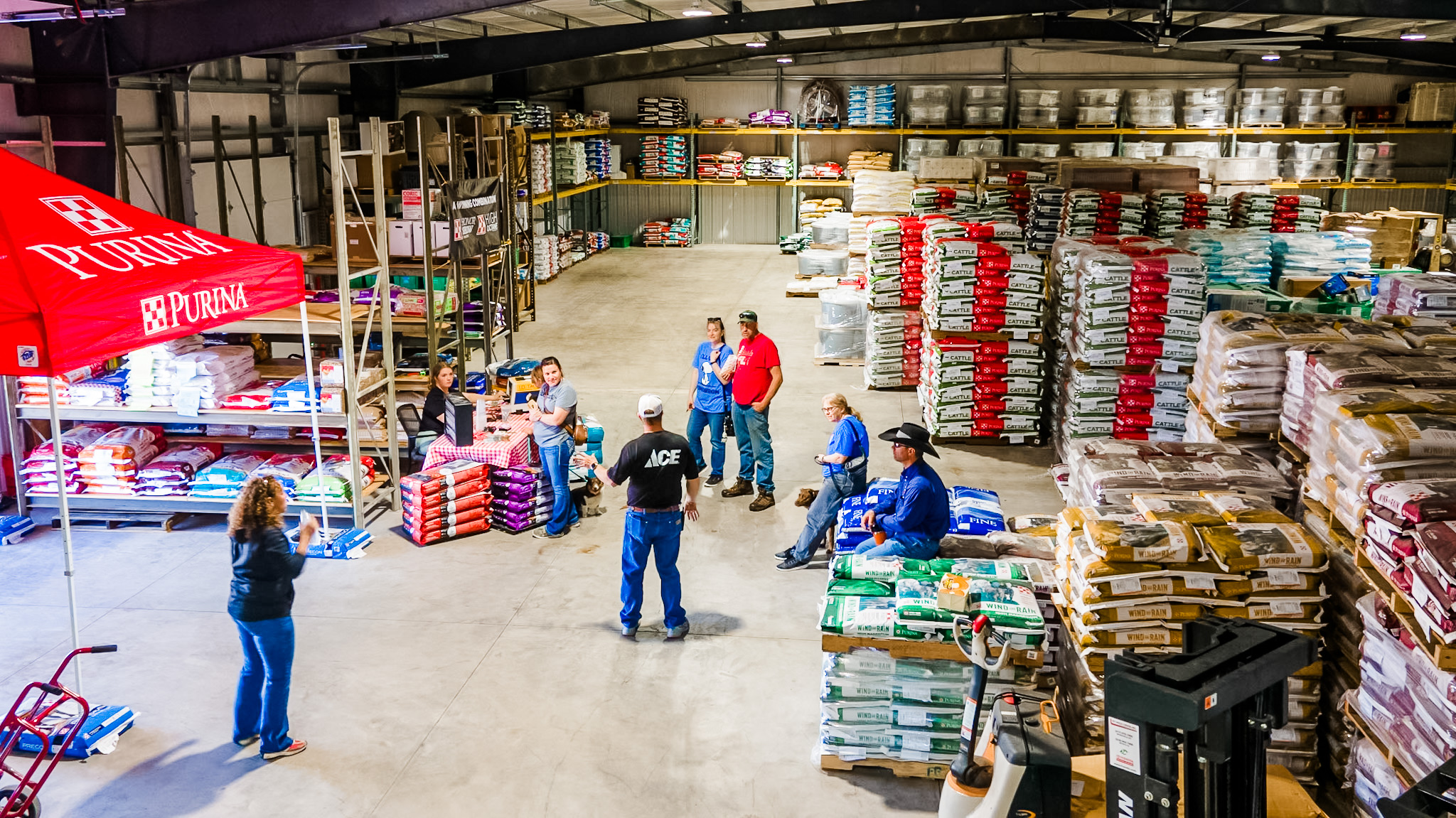 Wide aerial view of Cleaver Farm & Home yard and buildings